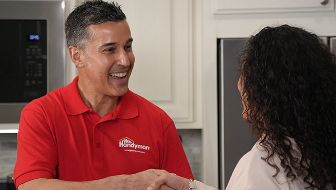 mrh_handshake_usa_desktop_656x371_rs A Mr. Handyman service professional shaking hands with a customer.